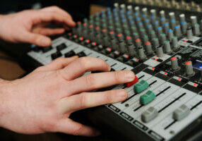 Closeup audio mixer with buttons